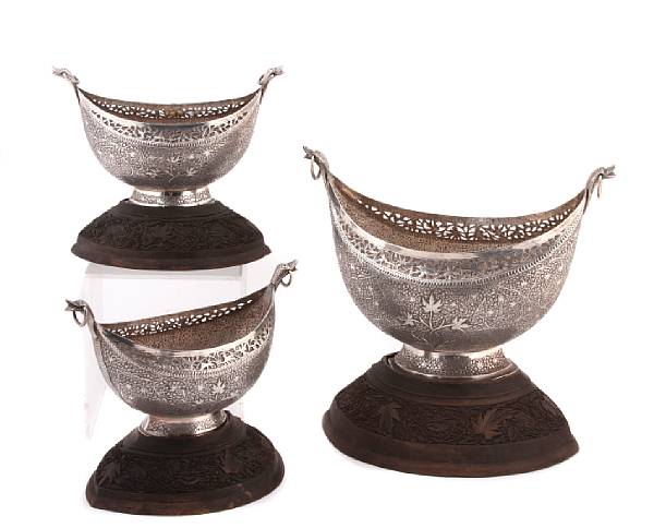 Appraisal: A suite of three Indian silver garniture bowls with matching