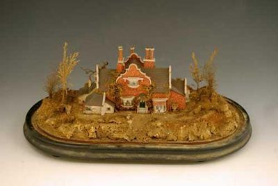 Appraisal: A painted card model of a house with bay windows