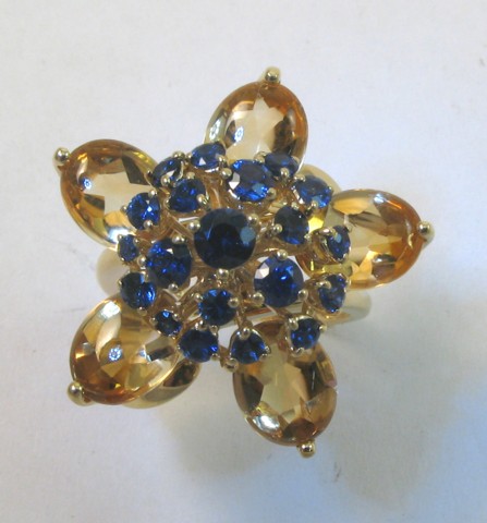 Appraisal: SAPPHIRE AND CITRINE FLORAL RING k yellow gold set with