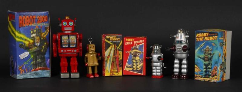 Appraisal: Lot of Tin Contemporary Robot Toys Description Includes four original