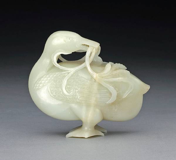 Appraisal: A white jade carving of a duck th Century Standing