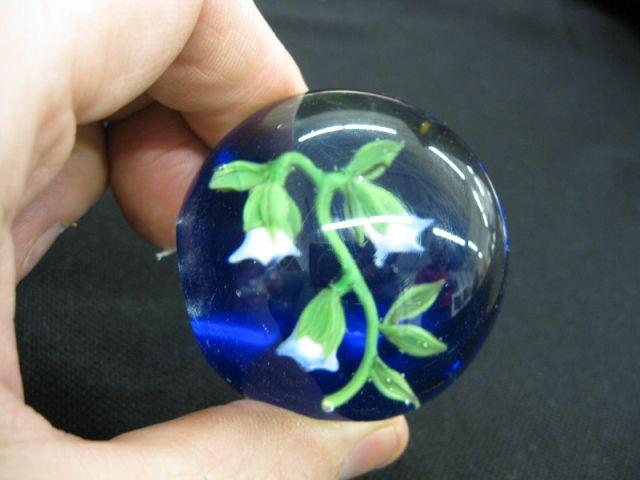 Appraisal: Art Glass Paperweight morning glory style floral on rich blue