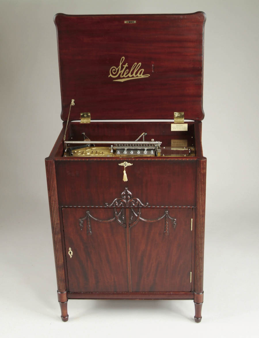 Appraisal: STELLA DISC CONSOLE MUSIC BOX Console mahogany case with fluted