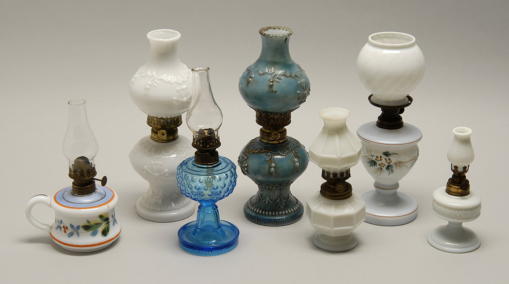 Appraisal: SEVEN MINIATURE LAMPS Five are opaque white one opaque blue