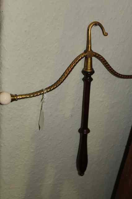 Appraisal: A TH CENTURY LACQUERED BRASS AND MAHOGANY COAT HANGER with