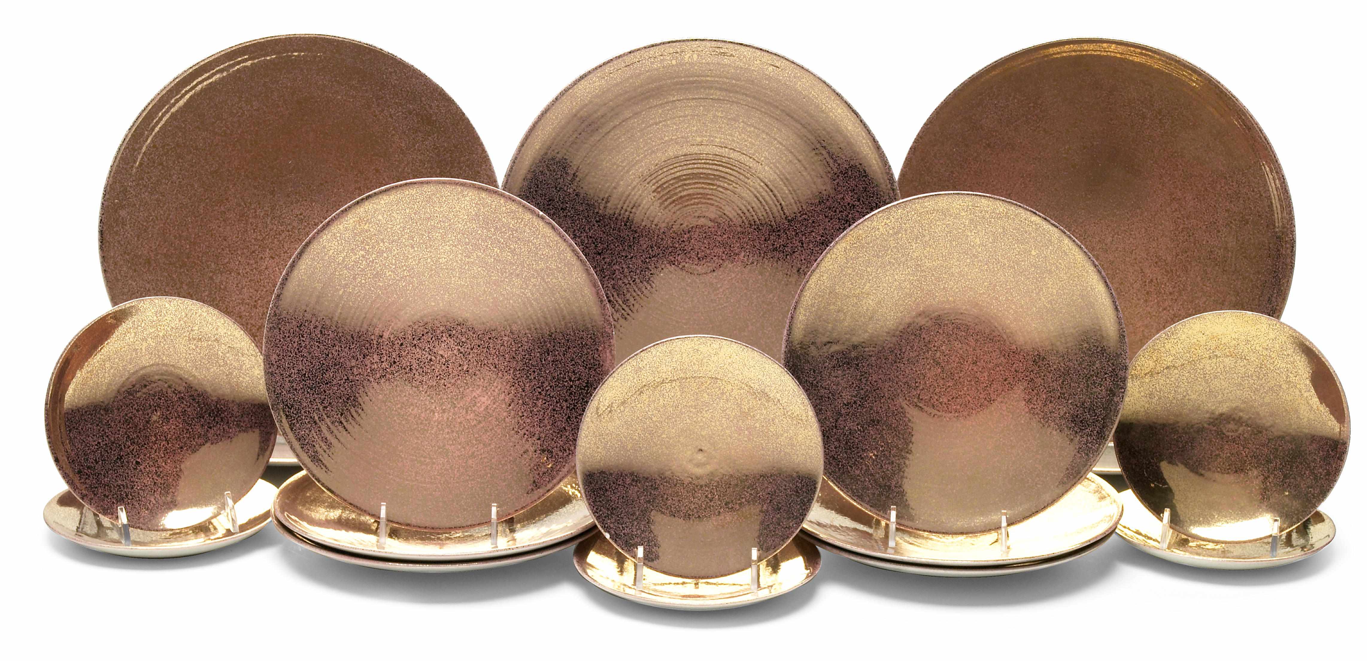 Appraisal: A copper glazed ceramic dinner service for six retailed by