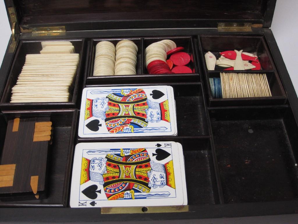 Appraisal: A rosewood Box with brass inlay containing playing cards counters