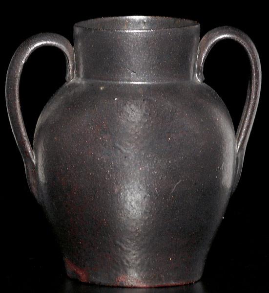 Appraisal: GEORGE OHR Small two-handled vase covered in brown gun-metal glaze