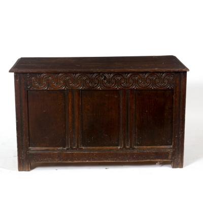 Appraisal: A late th Century oak chest with carved frieze planked