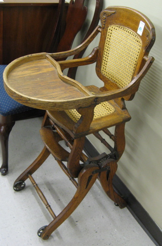 Appraisal: TWO AMERICAN OAK HIGHCHAIRS The lot includes one standard highchair