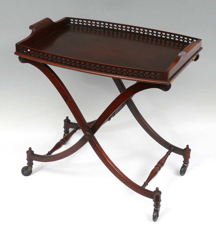 Appraisal: MAHOGANY TEA TRAY TABLE Lift off tray folding base on