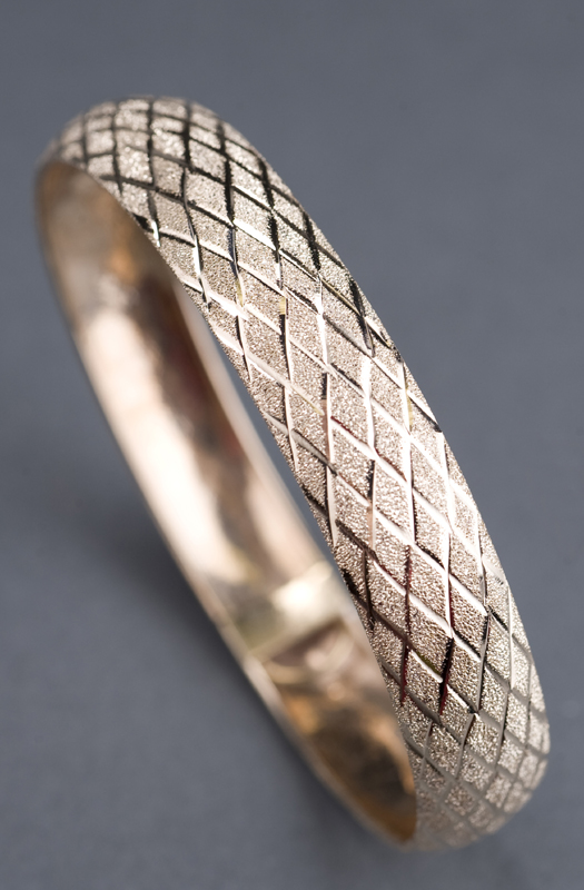 Appraisal: KT yellow gold concave bangle bracelet Bracelet is Florentine with