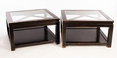 Appraisal: A pair of ebonised coffee tables with inset glass tops