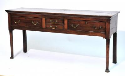 Appraisal: A GEORGE III FRUITWOOD LOW DRESSER with moulded edge top