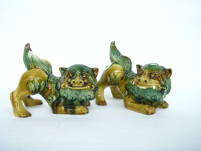 Appraisal: Pair of Ceramic Foo Dogs green and gold glaze one