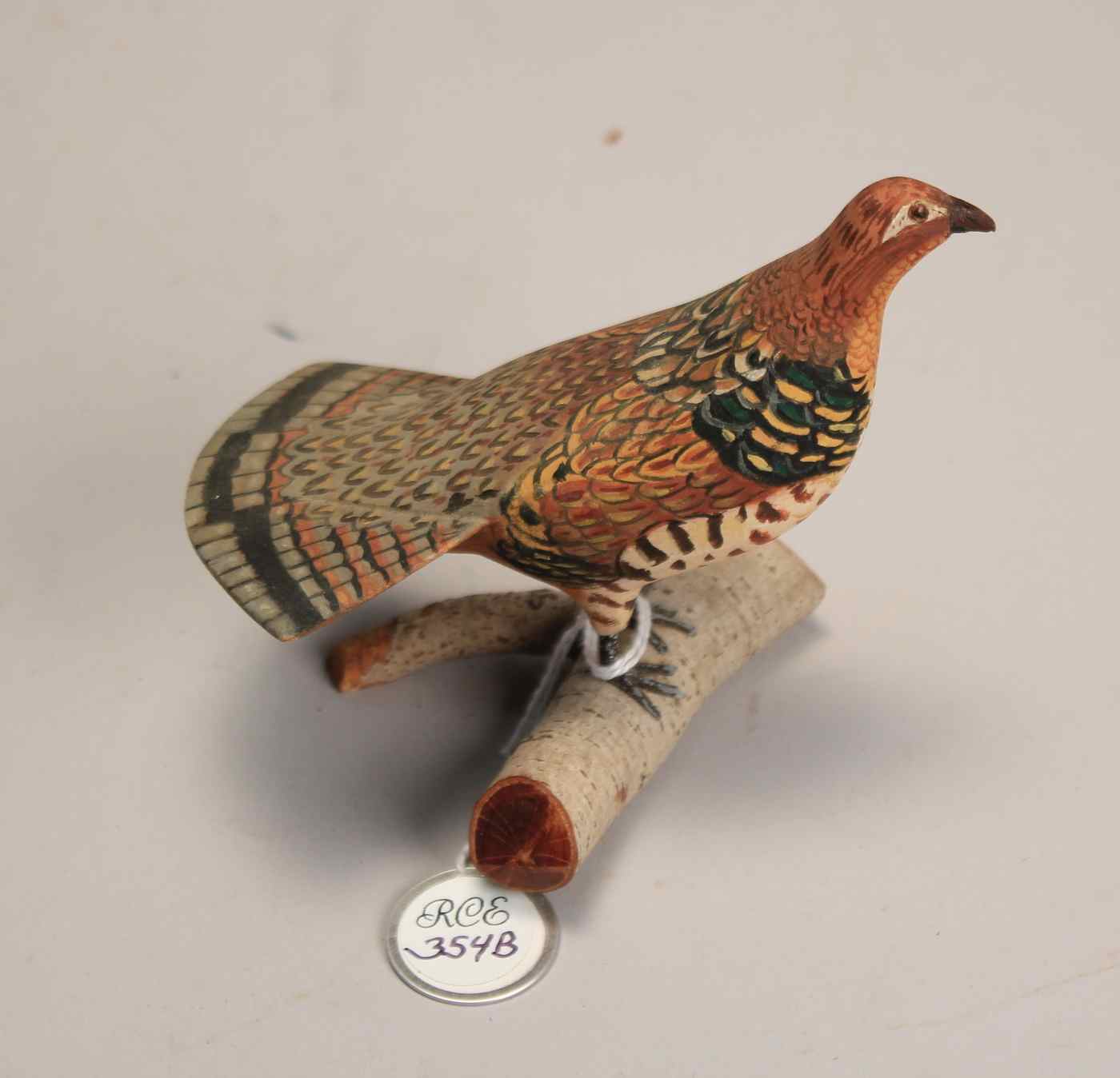 Appraisal: MINIATURE RUFFED GROUSEBy J Ahearn Mounted on a birch bark