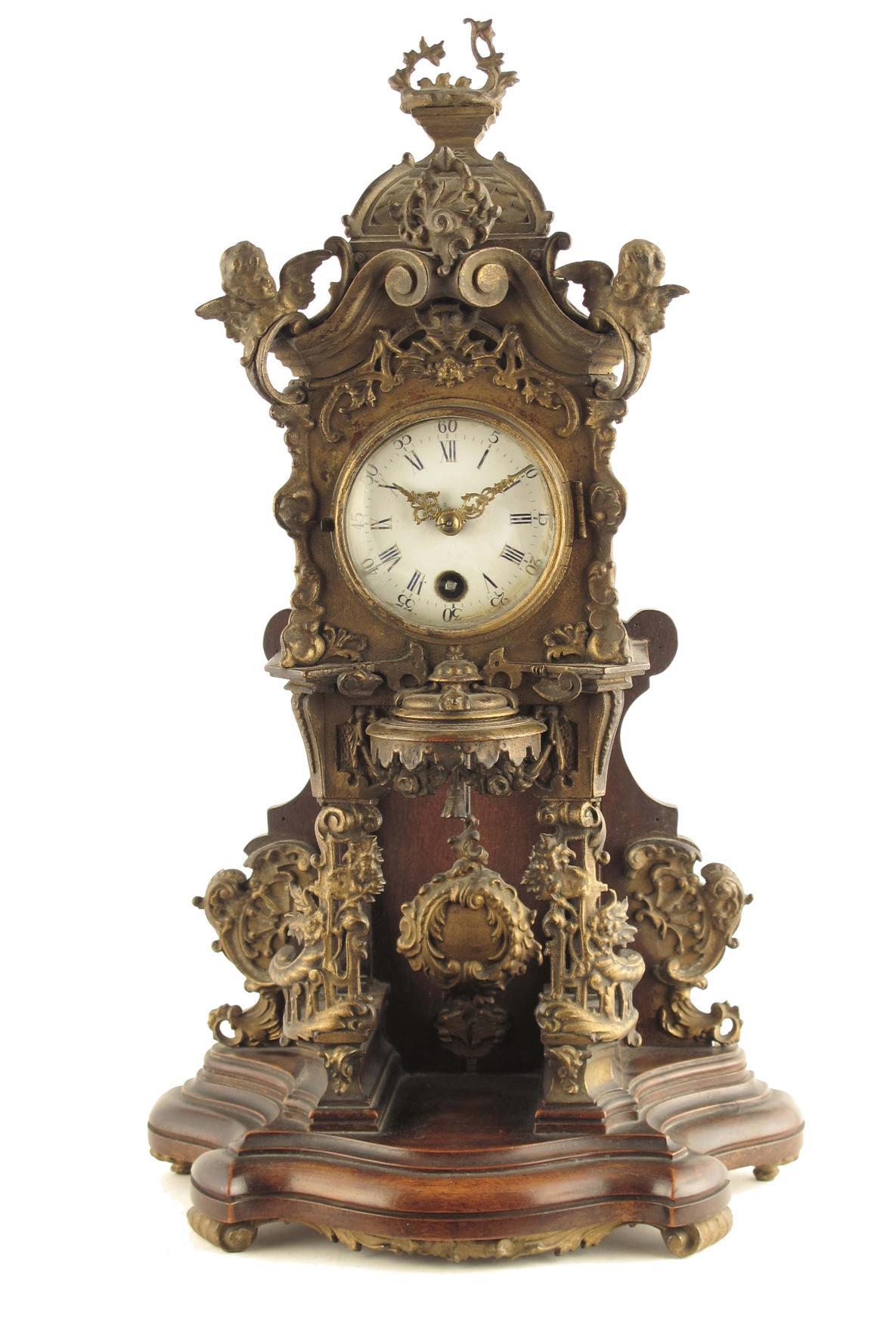 Appraisal: A walnut and parcel gilt mantel timepiece