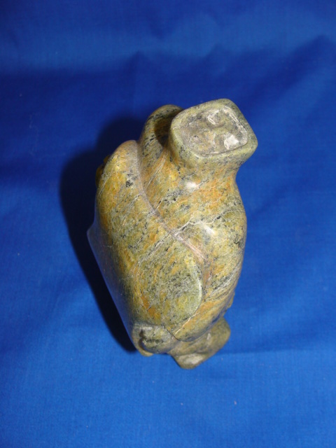 Appraisal: TYTOOSIE TUNNILLIE Inuit th century Soapstone Figure of an Inuit