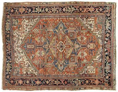 Appraisal: Heriz rug central medallion with blue highlights on brick red