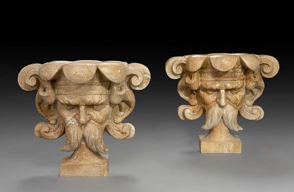 Appraisal: A pair of carved granite jardini res Of mask form