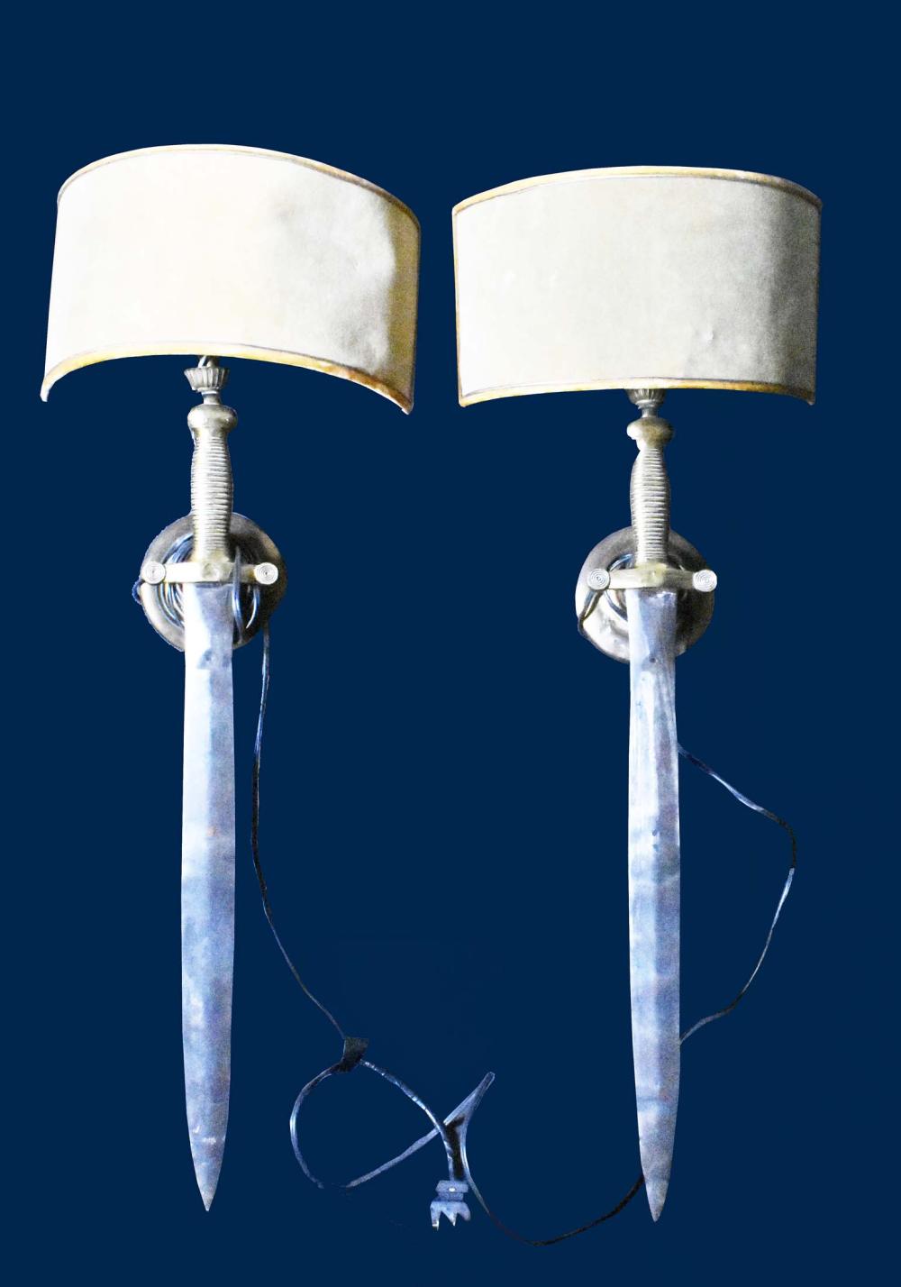 Appraisal: PAIR OF UNUSUAL BRASS AND STEEL SWORD WALL LIGHTSMid th