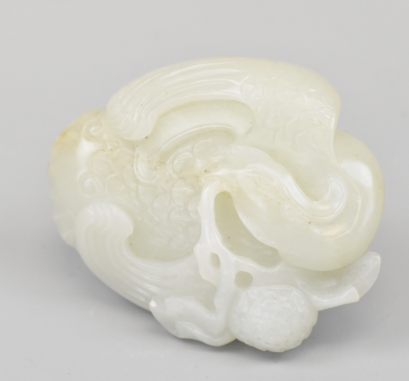 Appraisal: A Chinese white jade phoenix ornament carved on both sides