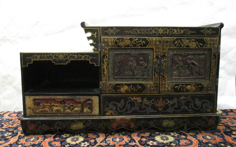 Appraisal: SMALL CHINESE STEP-TOP LOW CABINET with painted decoration on black