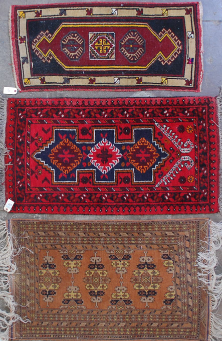 Appraisal: THREE AFGHANI TRIBAL AREA RUGS ' X ' ' x