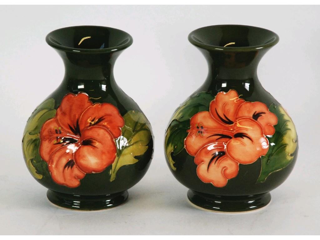 Appraisal: PAIR OF WALTER MOORCROFT 'HIBISCUS' PATTERN TUBE LINED POTTERY VASES