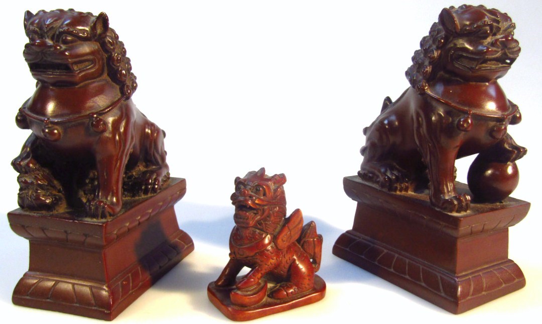 Appraisal: A Chinese hardwood finished netsuke formed as a temple dog