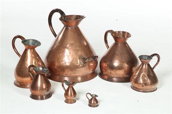 Appraisal: SEVEN COPPER HAYSTACK MEASURES England th century copper Assembled set