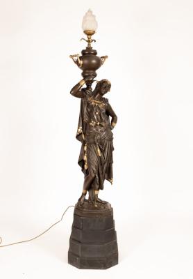 Appraisal: A spelter figural floor lamp modelled as a female figure