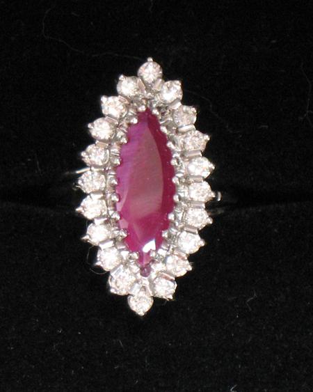 Appraisal: A MODERN RUBY AND DIAMOND CLUSTER RING the central marquise-shaped