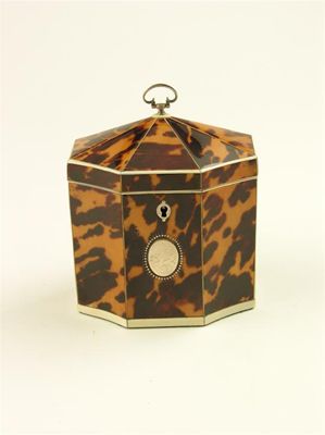 Appraisal: A George III tortoiseshell and ivory strung octagonal tea caddy