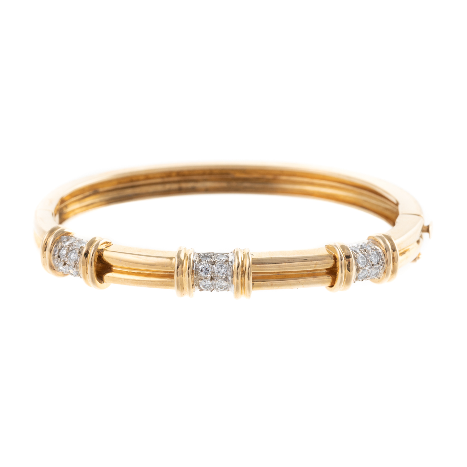 Appraisal: A DIAMOND HINGED BANGLE IN K K yellow gold oval