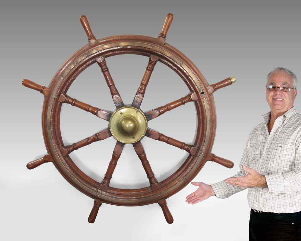 Appraisal: ANTIQUE WOOD AND BRASS SHIPS WHEEL Salvaged and brought to