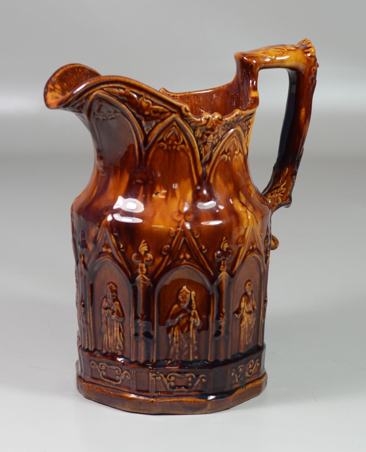 Appraisal: Rockingham style pitcher Eight Apostles shown in arches around body