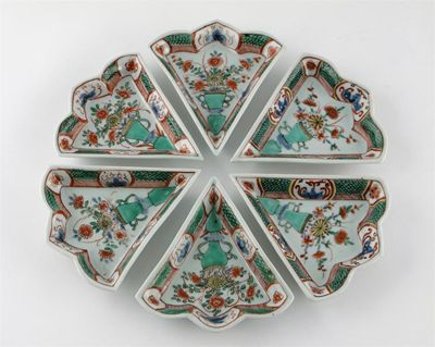 Appraisal: A Chinese famille verte supper set comprising six fan-shaped dishes