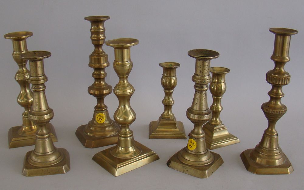 Appraisal: EIGHT ANTIQUE BRASS PUSH-UP CANDLESTICKS th CenturyHeights from to