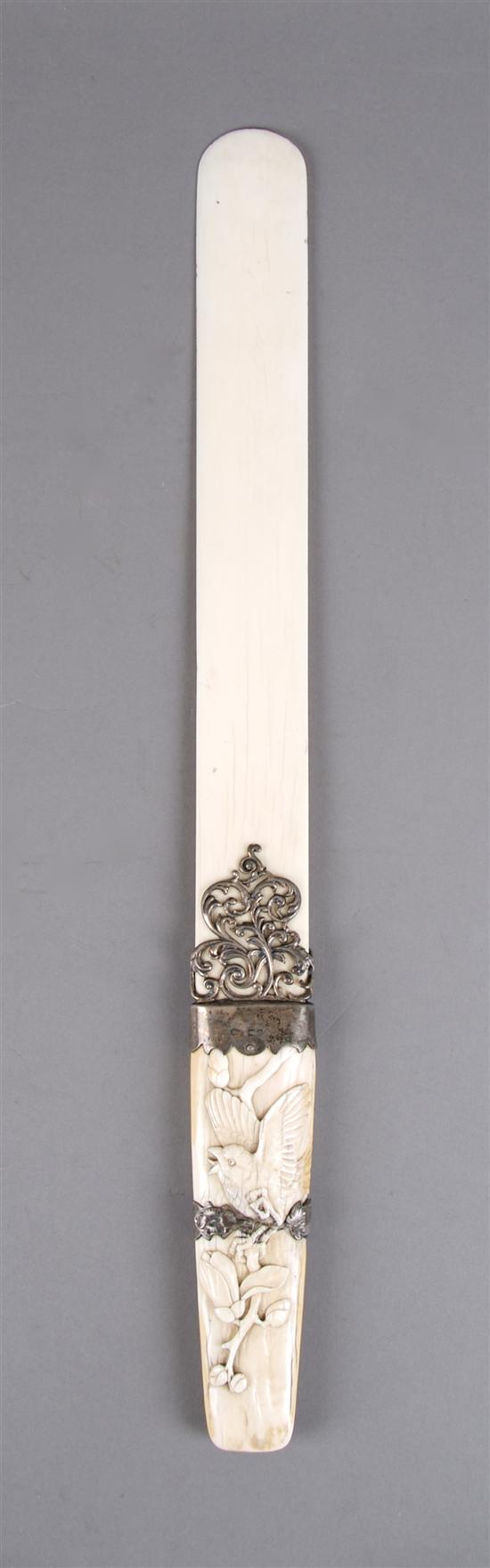 Appraisal: A Carved Ivory and Silver Page Turner Length x width