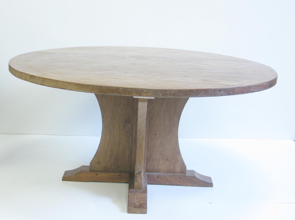 Appraisal: A Craftsman made adzed oak circular Dining Table by Wilfred