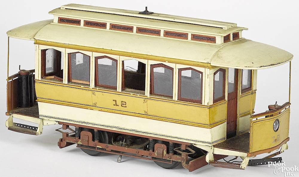 Appraisal: Painted wood trolley car Painted wood trolley car with interior