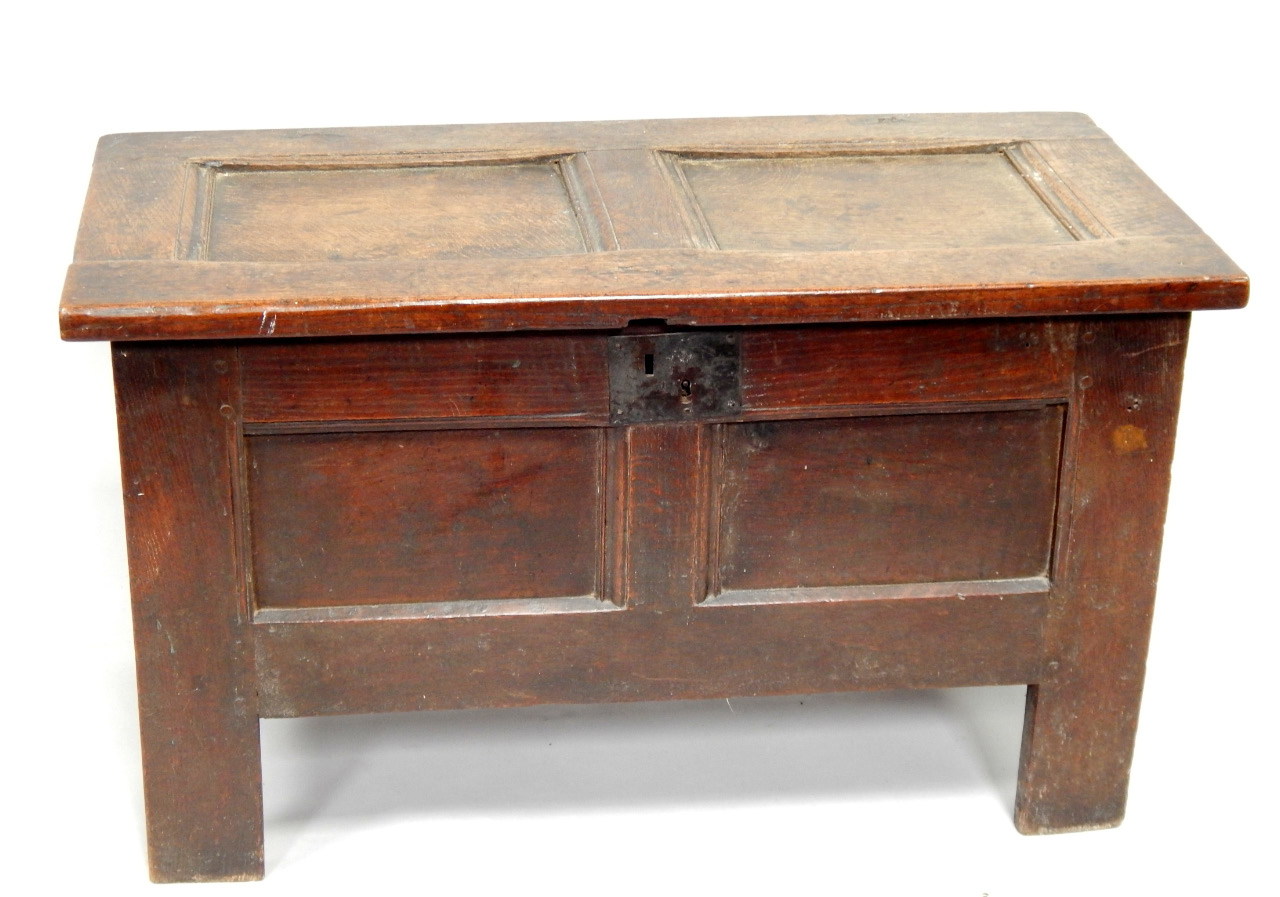 Appraisal: An thC small oak coffer with hinged panelled lid and