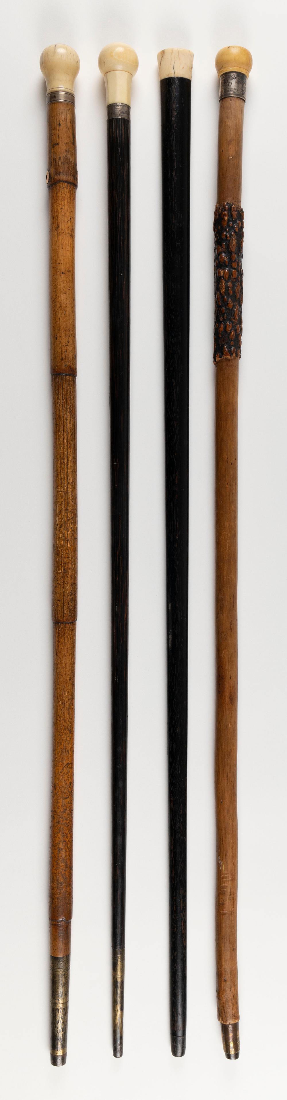 Appraisal: FOUR WOOD CANES WITH WHALE IVORY HANDLES TH CENTURY LENGTHS