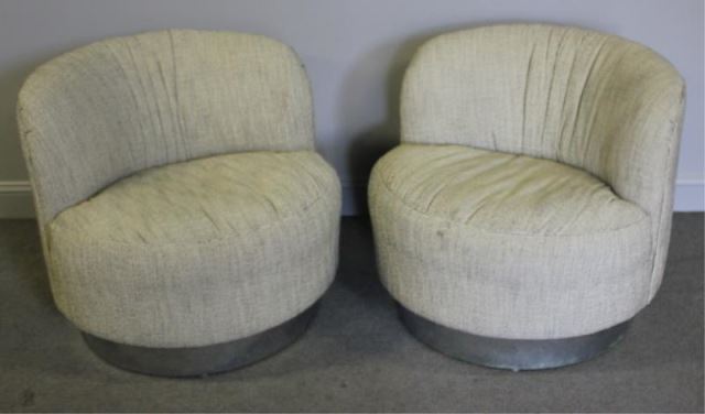 Appraisal: Pair of Midcentury Upholstered Club Chairs Chairs raised on circular