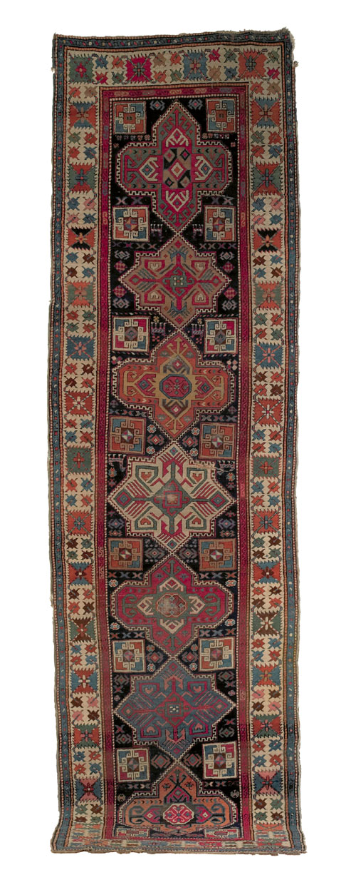 Appraisal: Akstafa runner ca with seven medallions on a blue field