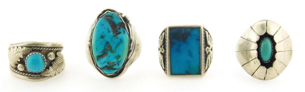 Appraisal: Four Southwestern solitaire style silver rings set with blueish turquoise