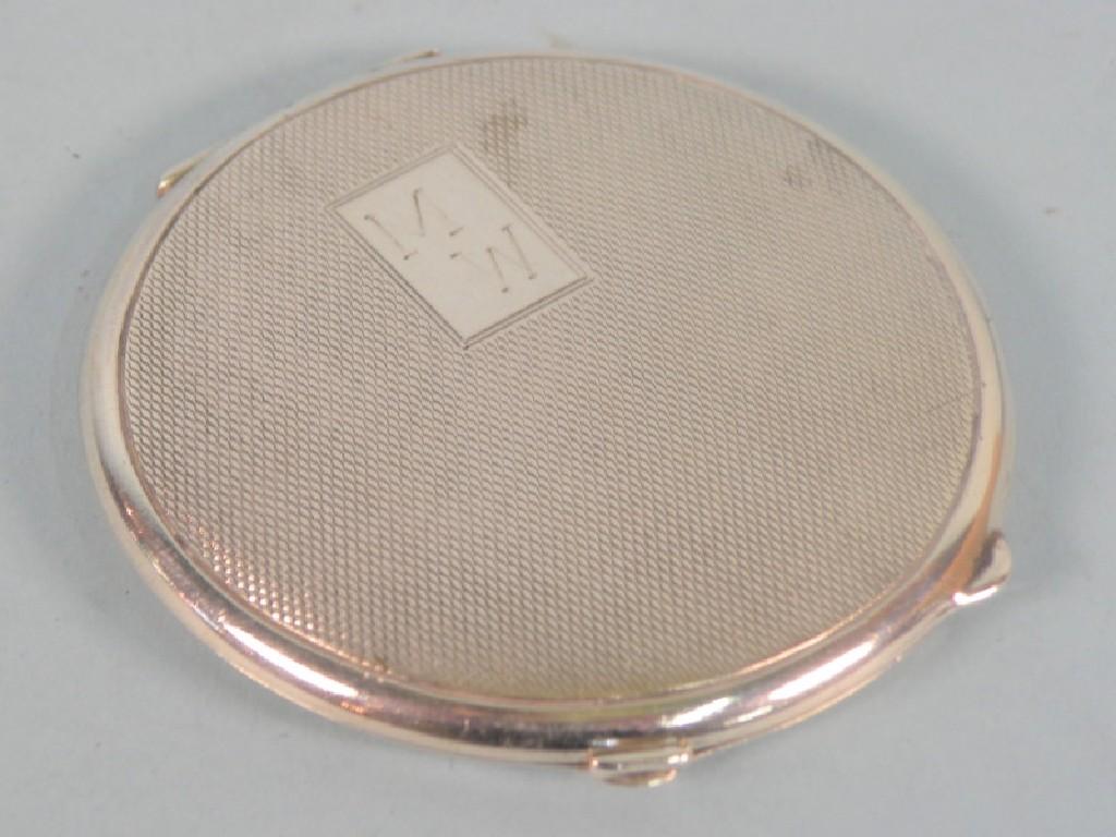 Appraisal: A engine turned circular silver compact bearing the initials M