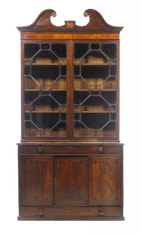 Appraisal: A GEORGE III MAHOGANY BOOKCASE with inlaid swan neck pediment