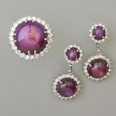 Appraisal: PURPLE STAR SAPPHIRE AND DIAMOND RING AND EARRINGS k wg